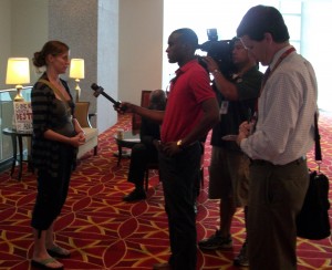 Heather Emmert speaks with the press after the forum