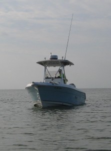 My brother, Joe, captaining his boat on one of our many trips to the Katrina Cut beaches